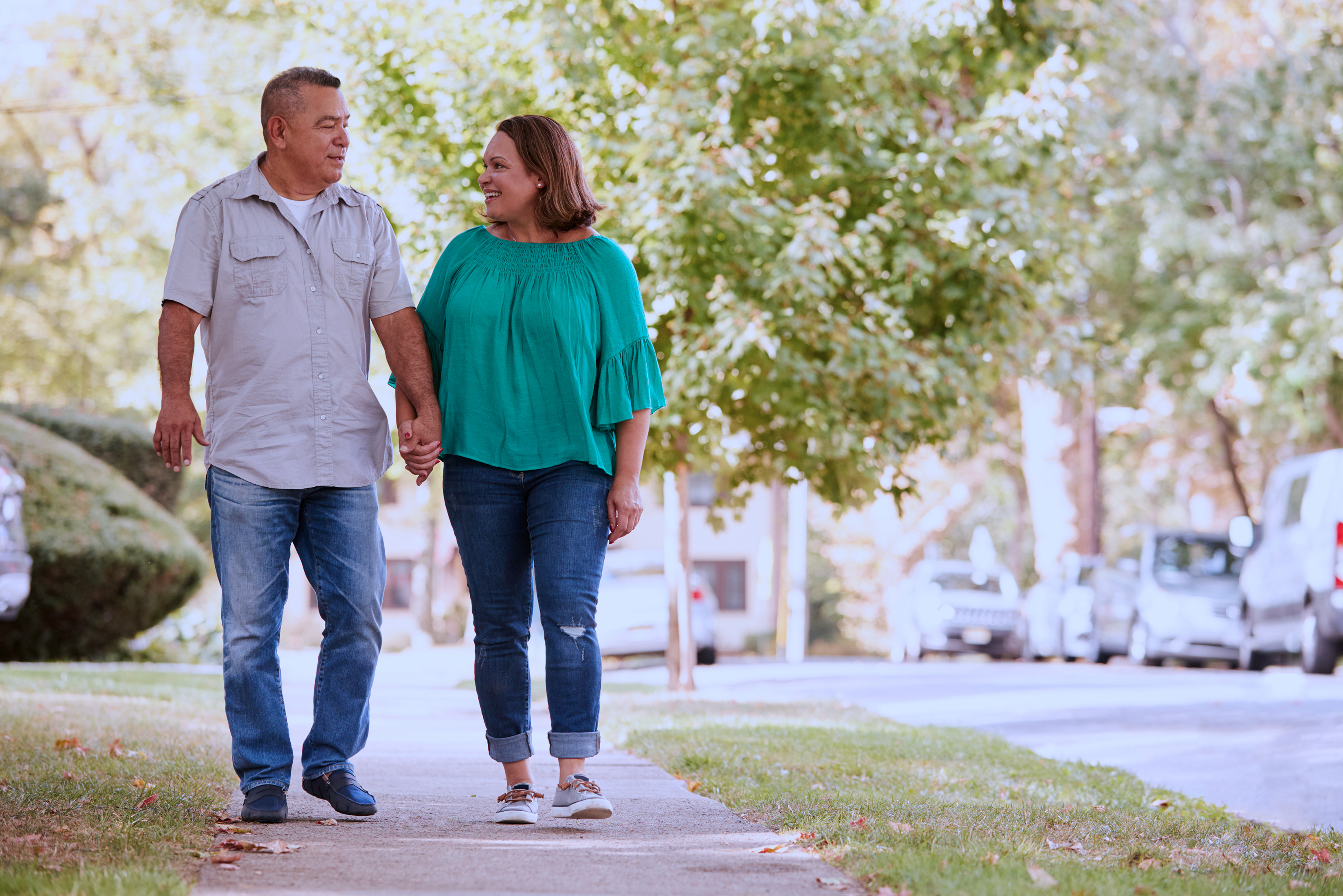 Mature couple walking holding hands